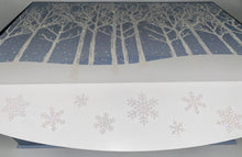 Load image into Gallery viewer, Included in our Medium gift:
A gorgeous flip-top winter wonderland box reusable box, A Fresh Snowfall fragrant blue candle, A Nordic Pine scent regular size hand soap shaped in a silver globe, A Soft white headband, A Cozy pair of socks, A double pack of Livegreen Looftahs,  Bath & Body's Pure Wonder Lotion and Bath and Body Body Wash, a box of Walker cookies, Chocolates and more. This gift will be wrapped with a notecard and a beautiful handmade bow.
