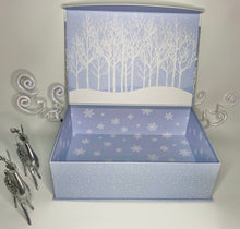 Load image into Gallery viewer, In our Small gift box, we have included:
This gift includes a gorgeous flip-top reusable winter wonderland box, A Lovely candle, a designed handsoap, a double pack of soft hair turbans, a pair of soft, cozy socks, a Loofah, Cookies, Crispy Crackers, a Cheese Spreader, Choclates, and so much more. It will be wrapped with a notecard and a beautiful handmade bow.