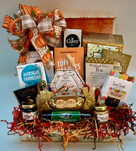 Load image into Gallery viewer, Inside, you’ll find gourmet delights including Water crackers, creamy Brie cheddar cheese, a savory beef sausage stick, Sweet and hot mustard, creamy artichoke dip, Focaccia crisps, Indulgent caramel popcorn, triple chocolate cookies, butter toffee peanuts, Cranberry harvest melody, strawberry preserves, and cocoa truffles, Dark chocolate-covered almonds, Guylian Belgian chocolates, European Delight hot cocoa, Highland select tea and more, with a handy knife spreader for effortless enjoyment.