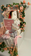 Load image into Gallery viewer, with a beautiful matching handmade bow and card.
Each item is thoughtfully chosen to provide both joy and practicality for the new parents and their bundle of joy. *(Please be advised the crate pictured is a custom gift and our base price starts at $300.00.)* Reach out to us if you prefer to have us make a smaller gift!
Whether you're celebrating with friends and family locally or sending your love from afar, our team at Perfect Selection Creative Gifts is here to make gifting a breeze.