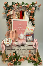 Load image into Gallery viewer, to keep the little one company, practical baby items such as bibs, burp clothes, or baby necessities, educational books to kickstart a love for reading from day one, a handprint cast, and so much more!
All crates and letters will be painted white. (Please reach out if you want the letter or crate painted differently.) Please select your gift-color in the drop-down. We will do our best to stay as close to neutral colors as possible. We will hand-select beautiful items and wrap this gift in a cello