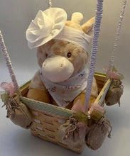 Load image into Gallery viewer, Basket Full of Surprises: Take a peek inside the basket and discover a delightful array of treasures: a cute stuffed animal companion, a book to spark imagination, and even a hairband for our little princesses. And yes, we've got goodies for the little dudes too! These hot air balloons aren't just decorations; they're invitations to explore and dream. Perfect for any child's room, they add a touch of whimsy and wonder that's simply irresistible.