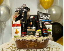 Load image into Gallery viewer, This Ultimate beer drinkers gift basket is "All the Rage!" curated in a reusable container that measures 18" x 9" X 6".  We have included a variety of six different North Carolina beers and delicious treats and snacks, this gift is a party in itself! Perfect for Birthdays, Father's Day, Mother's Day, Grandparents Day, New Dad & Mom, Bosses Day, or just for that beer lover.