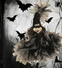 Load image into Gallery viewer, Greet your favorite ghouls and goblins this Halloween with our whimsical "Witchy Witch... Oh, my!" wall/door decor! This one-of-a-kind witch hat is crafted with a black and silver mesh mix and fully bedazzled with glitzy silver accents, making sure your guests get a spooktacular welcome.