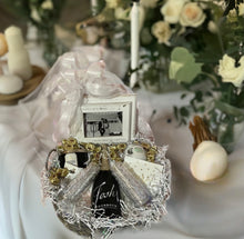 Load image into Gallery viewer, Brace yourselves for the ultimate celebration in a basket! Introducing our "Bride & Groom Celebratory Gift," a treasure chest of romance and joy, perfectly crafted for the newlyweds to dive into love's bliss! Imagine unboxing this beautifully curated reusable whitewash gray basket, a treasure trove of love waiting to be explored.