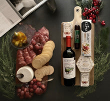 Load image into Gallery viewer, Indulge in the perfect pairing of flavors and elegance with our "Vine Graze Charcuterie Board" or "Savor Sip Board". This delightful gift includes:
A large, stylish charcuterie board with a handle (20" x 8.5" x 1/2")—perfect for entertaining or as a keepsake.
Your choice of red or white wine to complement every bite.
Creamy Brie cheese spread and crisp water crackers for a classic pairing.
Decadent Cashew Roca for a touch of sweetness.
A savory sausage stick to round out the board.