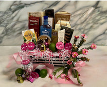 Load image into Gallery viewer, Get ready to party in style with our fabulous Cosmo Cocktail therapy happy hour gift box! This chic market box is meticulously crafted with a delightful selection of treats guaranteed to make your taste buds dance. Prepare to indulge in a feast of Butter Toffee pretzels, Bruschetta chips, Cheese, Water crackers, Pirouline wafers, Chocolate-covered almonds, Cheese straws, Toffee nuts, Chocolate silk cookies, Vegetable dip, Cosmo mixers, and a sleek stainless steel shaker (as seen in the photo).