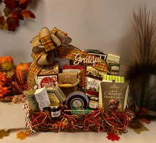 Load image into Gallery viewer, Make your holiday gifting unforgettable with our "Grateful Holiday Basket" —a perfect blend of gratitude and indulgence. Thoughtfully curated, it features creamy cheeses, wine biscuits, pretzels, water crackers, caramel popcorn, savory meats, dip mixes, cookies, chocolates, toffee pretzels, premium coffee, mustards, jellies, and so much more.