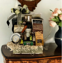 Load image into Gallery viewer, "The World Traveler" gift basket is here, and it's the ultimate "Adventure Awaits" package! This bad boy is so awesome, it's practically got its passport stamped with "Best Seller" status. And let me tell you, it's not just a gift; it's a ticket to joy for anyone who's all about exploring or hoarding travel memories in style. Buckle up, because this is a wild ride!