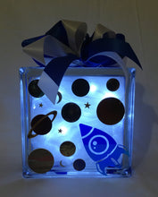Load image into Gallery viewer, With a astronaut, planets, and spaceship on it this light block will decorate any child's bedroom or playroom with a subtle light!