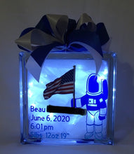 Load image into Gallery viewer, A Boy and His Spaceship... is a perfect gift for a new baby night light or any child's playroom. It can be customized for either a boy or a girl. We can customize this block with a prayer, footprints, weight, height, date of birth, time of birth, and photos provided by you. We will finish it with battery-operated or plug-in lights per your request.
