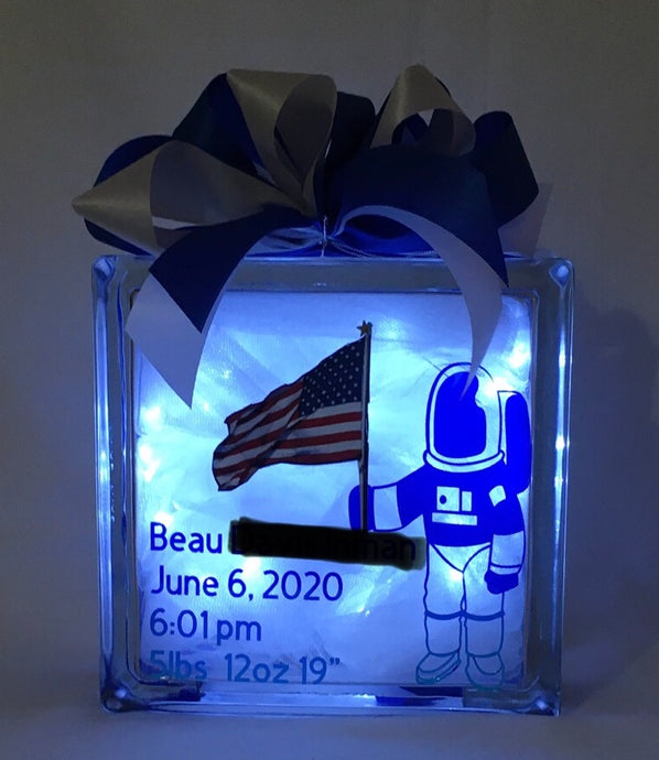 A Boy and His Spaceship... is a perfect gift for a new baby night light or any child's playroom. It can be customized for either a boy or a girl. We can customize this block with a prayer, footprints, weight, height, date of birth, time of birth, and photos provided by you. We will finish it with battery-operated or plug-in lights per your request.