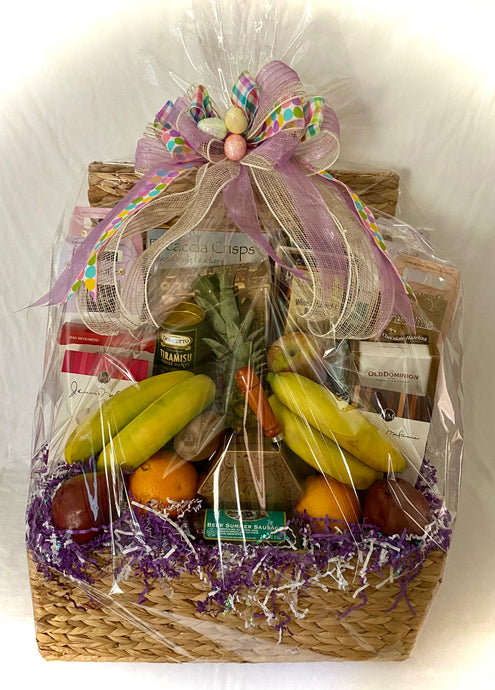 Easter Celebration Basket of Fresh Fruits and Gourmet Treats is an abundantly filled flip-top basket exploding with fresh fruits in season and gourmet sweet and savory treats chosen by us. It's perfect to send to a special someone, hostess, or just because you want to wish them a Happy Easter! We have selected some of these fresh fruits in season such as pineapple, oranges, apples, kiwis, bananas, mangos, pears, and more.