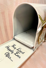 Load image into Gallery viewer, The outside has the extra-large Mr. & Mrs., the other side has Cards on a burlap, lace ribbon with rose gold vinyl letters, and mini roses as per brides' request. On the outer door the Est. date, on the inner door "They Lived Happily Ever After..." The flag and handle were sprayed in rose gold and accessorized with mini roses.