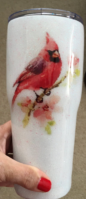 I'm Always with You Love, Popa... This 30-ounce tumbler is decorated with a white iridescent super fine glitter, cardinal, and metallic vinyl and resin. This stainless tumbler is great for any hot or cold drink and can hold 30 fluid ounces with a lid. These tumblers can be ready in one to two weeks. We can personalize and customize these tumblers. We carry several different stainless tumblers in a variety of sizes