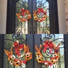 Load image into Gallery viewer, Autumn Welcome... this beautifully handmade grapevine wreath is decorated with silk sunflowers, pumpkins, fall-colored leaves, gourds, berries, greens, and so much more! Finished with a beautiful handmade bow nothing says "Happy Fall" like this beautifully decorated wreath! This wreath will welcome all your guests and would look great on any door or wall. Grapevine wreaths are all different in size therefore if ordering by two for a double door we will do our best to get them as close as possible in size.
