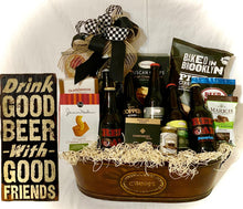 Load image into Gallery viewer, Your gift comes wrapped in a cello with a beautiful handmade bow and notecard. This gift may be locally delivered with adult beverages and must be left with an adult unless you add non-alcoholic beer, sodas, or extra snack choices. Please choose from the dropdown or chat with us on our website or call/text us. Give them a Beers & Cheers Smile!