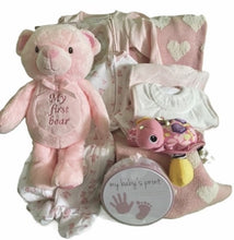 Load image into Gallery viewer, But that's not all – this box is bursting at the seams with cuteness galore! Wrap that bundle of joy in the softest, snuggliest blanket that feels like a hug from a cloud. And speaking of clouds, those sleep and plays one-piece outfits are cute clouds she can wear!
Oh, and did we mention the bibs? They're so stylish, that even Cinderella would be envious. And speaking of Cinderella, our "my baby’s print" memory cast will have you swooning over those tiny princess feet and hands!