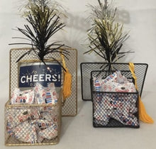 Load image into Gallery viewer, Congrats Grad! This container is Gold or Black and filled with mints that say Congrats Grad on them or it also can be made with candy or treats. We can add gift cards at the value of your choice. It will be wrapped in a cello, with a card, and with a beautiful handmade bow. Priced according to gift card amount.  Don't know what to get your grad... gift cards to their favorite place always work! Let us know if we can put a smile on someone special's face!