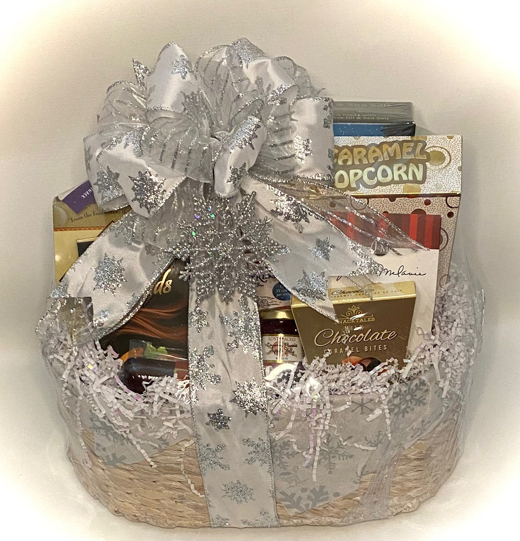 We are thrilled to unveil our latest offering, the Snowflake Sensation Gourmet Gift Basket—a meticulously curated assortment designed to captivate your taste buds and embrace the essence of the season in culinary splendor.  Within this elegantly adorned basket, discover an array of handpicked delicacies poised to elevate your winter experience: