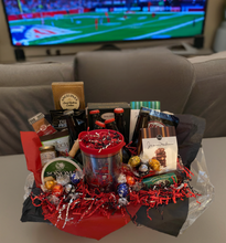 Load image into Gallery viewer, Introducing our &quot;Sports-Themed Gift Baskets&quot; A Home Run for super fans! Get your special someone game day ready!
Get ready to tackle game day with this tailgating treasure! We&#39;ve stuffed it with sweet, savory, and sporty surprises. Beer can be delivered locally ONLY!&nbsp; For those shipping this amazing gift we will load up on extra snacks! Please select in the drop-down which gift you prefer.