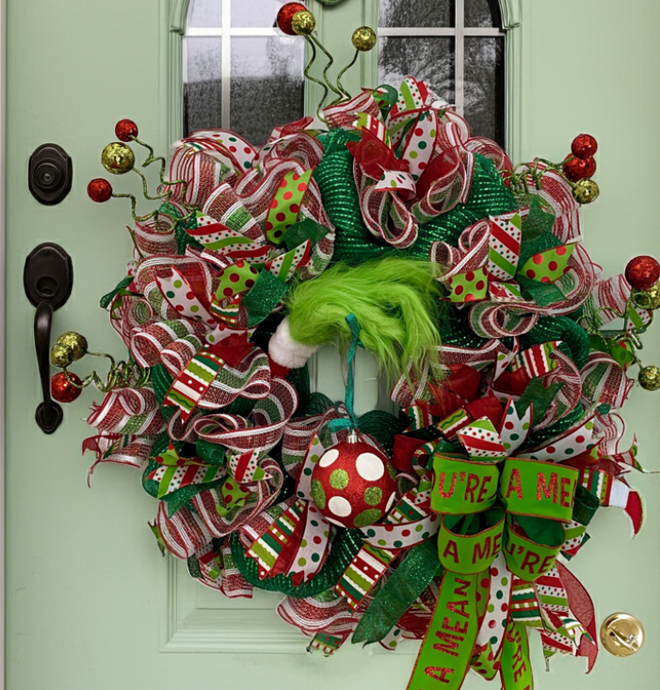The Grinch Strikes! Adding Some Sass to this Awesome Handmade Wreath! Picture this: a seriously cool mesh and ribbon wreath, all decked out with vibrant colors, hanging out on your door or wall. But wait for it... Who's sneaking in? The Grinch! That cheeky green guy just can't resist adding his touch to this already awesome wreath!

This wreath? It's a total dazzler at 36 inches of holiday cheer, filled with ribbons and ornaments in the raddest shades of red, green, and white. And here comes the Grinch,