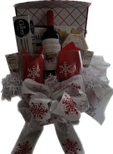 Load image into Gallery viewer, Celebrate the season with the Snowflake Splendor Gift Box, a stunning metallic red flip-top box adorned with shimmering silver snowflakes. This reusable box is filled with an elegant assortment of holiday treats, including:

Your choice of red or white wine.
Stemless wine glasses featuring delicate diamond snowflakes.
Water crackers
Creamy Brie cheese spread