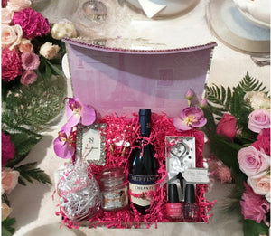 This particular elegant set includes a "Will You Be My Bridesmaid?" proposal, a heart-shaped bottle topper, a bridesmaid glass, a candle, a picture frame, beautiful earrings, nail polish, and more. Thoughtfully arranged, it’s the perfect way to ask your bridal party to stand by your side. (Your gift proposals will be priced accordingly.)