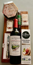 Load image into Gallery viewer, The Savor &amp; Sip Board is the perfect blend of style and flavor, featuring a 16&quot; x 8&quot; charcuterie board with a 5/8&quot; thickness and a versatile dish for cheese, olives, or dip.

This elegant gift includes:

A bottle of wine.
A creamy Brie cheese spread.
Crisp water crackers.
A savory sausage stick.
Decadent Cashew Roca, and more.
It’s ideal for celebrations, gifting, or indulging in a little luxury!