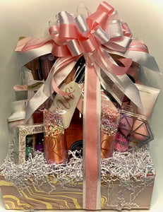 With this gift, our bride has all the necessities she will enjoy in preparing for her wedding and to go onto her destination honeymoon!  This custom-ordered gift box included her favorite essential oils, her Bath & Body shower gel and body lotion, makeup wipes, makeup sponges, two large loofahs, a Minnie Mouse headband, a hairbrush with cover for travel, hairclips, hand sanitizer, lip balm, Mrs. luggage tags, a bottle of Prosecco with two etched flutes as shown in the photos, and so much more!