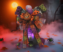 Load image into Gallery viewer, Looking to elevate your Halloween décor with a touch of eerie elegance? Our Halloween Lantern is the perfect way to spookify your space in style.

This striking glass-panel lantern stands approximately 20&quot; tall and features a battery-operated LED candle complete with an eyeball embellishment, a handmade bow topper, and interchangeable seasonal picks for a customized look. Whether displayed on a table, countertop, or hung for extra haunted charm, it makes a bold statement in any room.