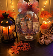 Load image into Gallery viewer, Trick or Treat Me is the ultimate gift to celebrate Halloween and fall. This reusable gift basket is filled with seasonal snacks, chocolate-covered almonds, and cozy hot cocoa, along with pampering items like Bath &amp; Body Works hand cream, soap, or body spray—perfect for a little self-care.