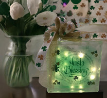 Load image into Gallery viewer, Illuminate your space with a touch of Irish magic! This charming light decor is the perfect addition to any room, radiating subtle warmth with its battery-operated glow. On one side, bask in the luck of the Irish with the enchanting Irish Blessing; on the flip side, revel in the whimsy of shamrocks dancing across the surface.