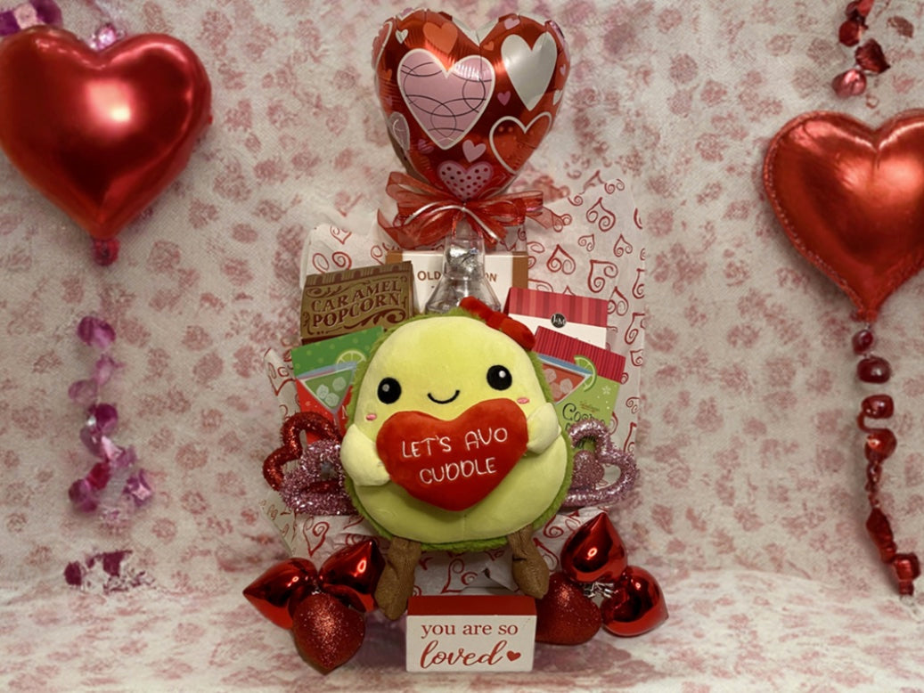 Get ready to guac 'n roll with our trendsetting Avocado stuffie! This adorable cutie isn't just any old fruit—it's the ultimate Valentine's Knockout!

We've curated a smashing assortment of treats fit for the occasion! Picture this: a market tray overflowing with peanut brittle, caramel popcorn, raspberry cookies (yum!), not one but TWO drink mixes (Cosmo and margarita, because why settle for one party?), chocolate kisses (a sweet surprise!), a balloon for that extra pop of fun, and oh-so-much more!