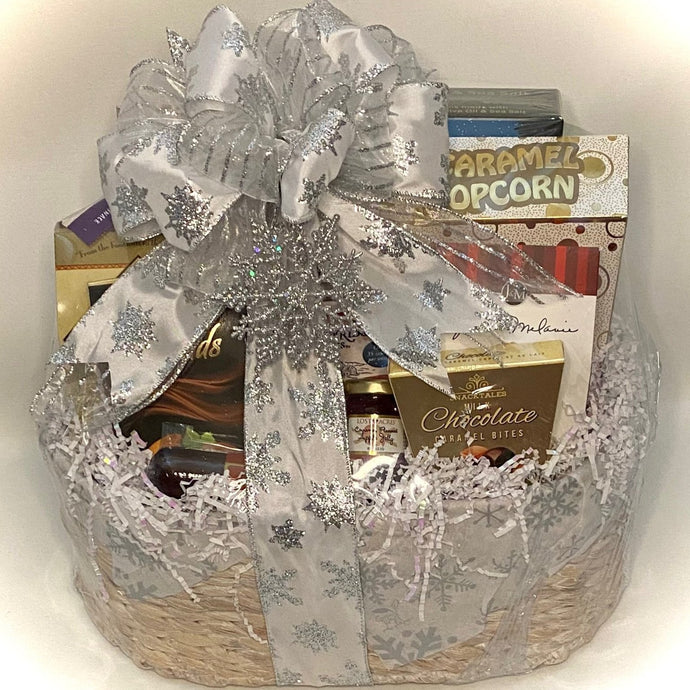 We are thrilled to unveil our latest offering, the Snowflake Sensation Gourmet Gift Basket—a meticulously curated assortment designed to captivate your taste buds and embrace the essence of the season in culinary splendor.  Within this elegantly adorned basket, discover an array of handpicked delicacies poised to elevate your winter experience: