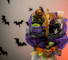 Load image into Gallery viewer, Brew up some magic with a fabulous, oversized Witches’ Brew mug—perfect for sipping your favorite potion (or pumpkin spice latte!). Light the cozy candle to set the mood, pamper yourself with the luxurious Bath &amp; Body Works Cashmere body lotion, and add a dash of fun with some chocolates and festive cocktail napkins. This basket is packed with all the wickedly good treats you need for the ultimate fall indulgence. Perfect for witchy vibes and cozy nights!