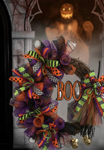 Load image into Gallery viewer, Get ready to add some Halloween charm to your front door with our &quot;Witch&#39;s BOO&quot; Broom Wreath!&quot; This handcrafted grapevine wreath features glitzy mesh, a whimsical witch&#39;s broom, playful ribbons, and a bold &quot;BOO&quot; sign that’s more fun than fright.