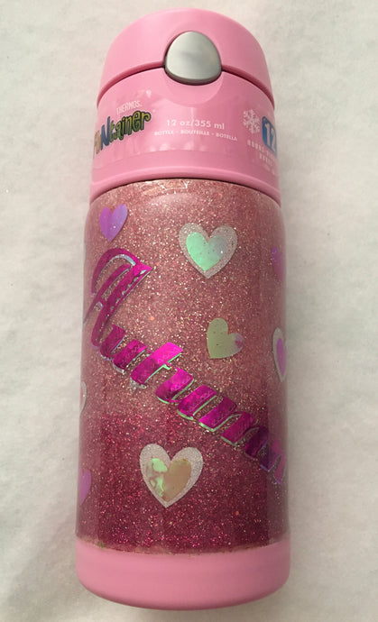 Pink Heart's kid's cup is a perfect gift for any child! This cup is a 12-ounce, spill-proof cup that can hold cold and warm drinks for any child. We have handmade this cup with extra fine glitter, vinyl, and FDA compliant epoxy. We can design your cup with any kind of personalization you like! This cup was a custom order for a little girl named Autumn. We carry several different stainless tumblers in a variety of sizes some have lids and straws.