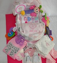 Load image into Gallery viewer, then wrapped with Bath Towels, Baby Blanket, Bibs, Burp Cloths, Outfit, Hat, Socks, Assorted Toys, Bathing Necessities and so much more!  This gift will come beautifully wrapped in a cello with a notecard and a beautiful handmade bow matching the gift. We can customize this gift by gender, size, and, color. Please contact us if the gift needs to be shipped. Due to the change in styles, seasons, and availability,  we reserve the right to substitute items for greater or equal value.