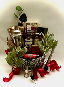 with a shot measuring cup, spoon, two pourers, Muller and a recipe book and so much more!   This gift comes beautifully wrapped in shrink wrap, with a notecard and a beautiful handmade bow. Adult beverages may only be locally delivered. If shipped we will substitute snack items to replace the rum. Please choose in the dropdown if you would like your order shipped or locally delivered. Send your special someone FUN with Rum! 
