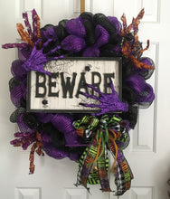 Load image into Gallery viewer, the season!

We can summon this spooky masterpiece to your doorstep, no matter where you are, as we offer both shipping and local delivery options. But beware! Due to its spine-chilling popularity, we&#39;re unable to procure the same items for every wreath. However, fear not, as we&#39;ll work our magic to customize wreaths with the same level of spookiness! Feel free to inquire about customization options.