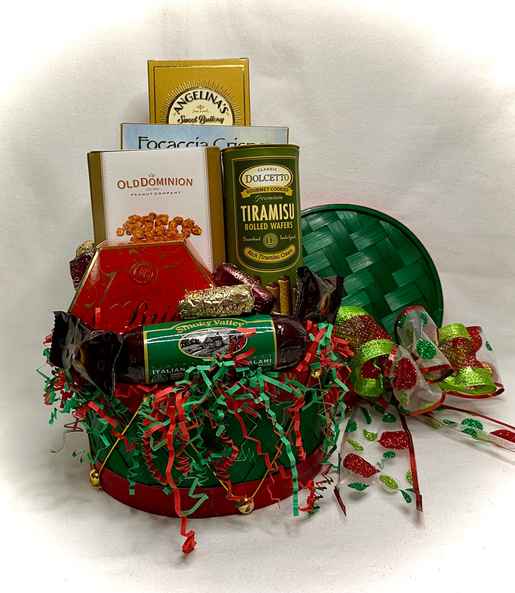 Our Holiday Drum is an adorable bamboo red and green drum filled with great snacks to send to your teachers, co-workers, family members, or friends. This adorable decorative reusable drum includes a variety of deliciousness! Cookies, Cracker Crisps, Old Dominion Nuts, Cheese Spread, Meat Stick, Rolled Wafers, Chocolates, Roca, and more!  This gift is perfect to share with your favorite someone. Wrapped in a cello with a notecard and a beautiful handmade bow this gift is sure to 