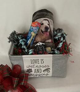 "Love is Wet Noses and Wagging Tails" ~ is the perfect container to fill with some adorable treats for a special pet. This was a custom-made gift for a special Mr. Furry Pants! It contains gifts for a 65lb. fur baby. A plush cuddle blanket, Hartz chew bone, a large rope toy, and an adorable picture holder, and much more! We may substitute items for equal or greater value. If you would like to customize your gift chat with us online. Containers for this gift are subject to availability. 