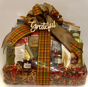 assorted cookies, caramel popcorn, dip mix, coffee, mustard, jelly, toffee pretzels, chocolate caramel bites and so much more! Your gift will come wrapped in a cello, with a notecard and a beautiful handmade bow.  What could be better than sharing a gift basket filled with an abundance of delicious treats for any holiday? Please let us know if we can customize this gift basket for you by color, content, or size. Let us make your special someone feel extra special! 