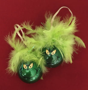 Our Grinch Christmas ornaments are handmade plastic ornaments coated inside with extra fine glitter, vinyl, and feathers on the outside. These ornaments will make all the Grinch's feel welcome!!! These are $10 each or three for $27.00. We can personalize these with names and we can ship these  Please allow a week for delivery. 