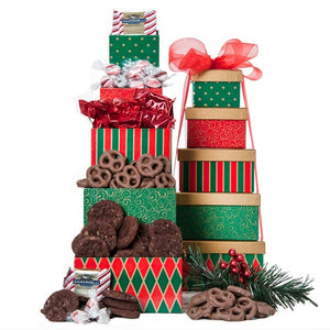 Christmas Holiday Gift Tower is filled with holiday treats for all to enjoy. This tower captures the nostalgia of the holiday season. Five festive boxes are filled to the brim with assorted treats that we have hand-selected. For corporate orders please call us. These boxes will be wrapped in festive ribbon and note tag. We can deliver locally and ship nationwide. Please note: gift contents are subject to change based on availability.