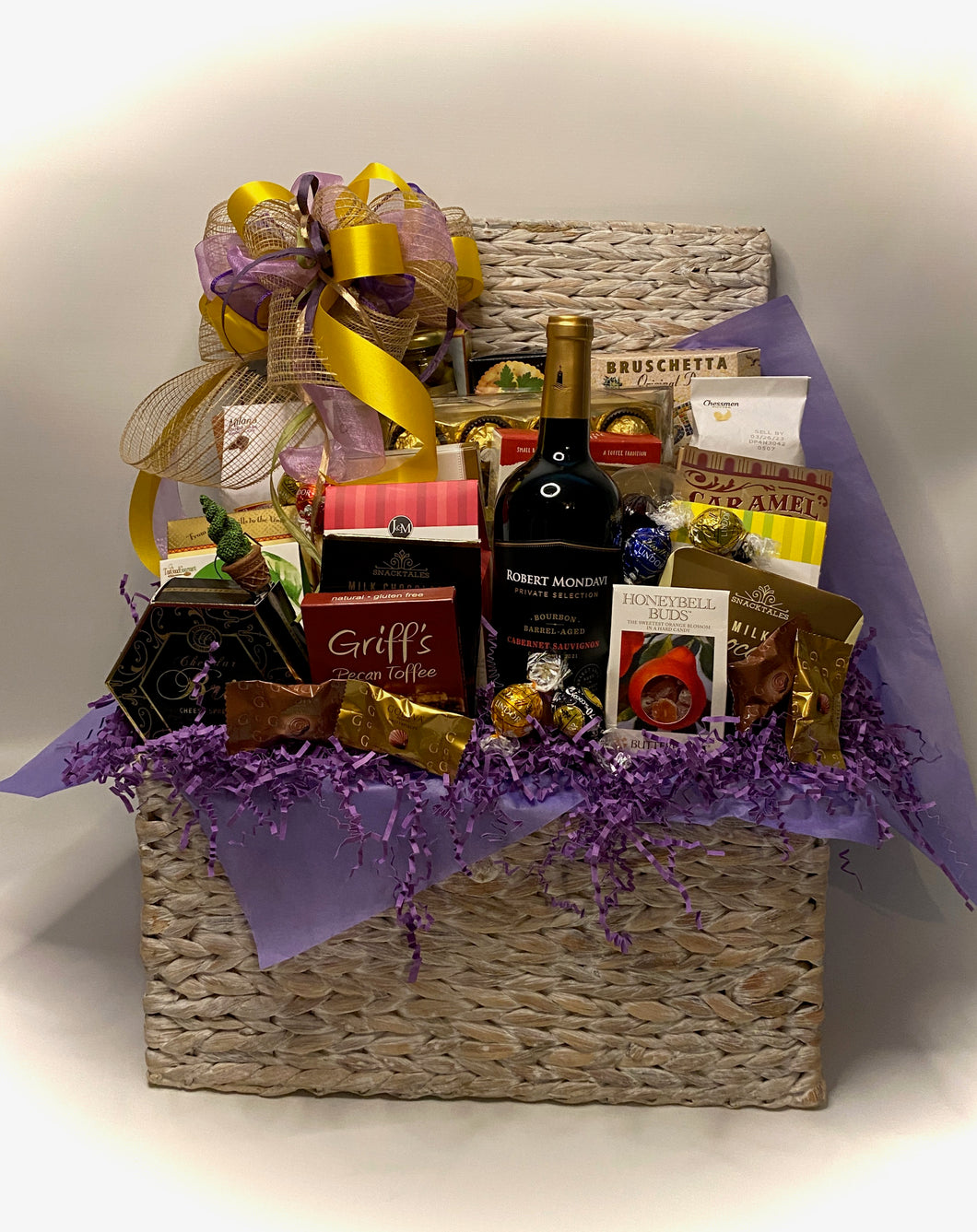 We also have chosen a variety of chocolates, crackers, cheeses, cheese spreaders, chocolate wafers, focaccia crips, bruschetta chips, water crackers, caramel popcorn, cookies, toffee pretzels, candied peanuts, biscotti and so much more! This gift comes beautifully wrapped in a cello, with a notecard and a beautiful handmade bow. 
