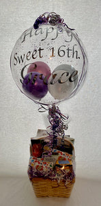"Happy Sweet 16th Grace" balloon was filled with iridescent purple, pink and white balloons for a young lady's Sweet 16 birthday! Ballon stick wrapped in ribbon and placed in a basket filled for this princess! 