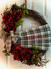 Load image into Gallery viewer, Welcome Wreath is a beautifully handmade wreath with silks, berries, pinecones, a handmade welcome sash made of fabric and printed vinyl, and a beautiful bow on an approximately 24&quot; oval grapevine wreath. This wreath says welcome to all your guests and would look great on any door or wall as decor. Grapevine wreaths are all different in sizes therefore if ordering by two for a double door we will do our best to get them as close as possible in size. We can deliver locally and ship.