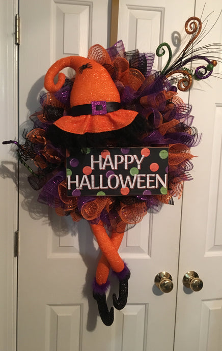 🎃🧙‍♀️ Happy Halloween, you marvelous witches! 🧙‍♀️🎃 Get ready to cackle with delight at our spooktacular handmade mesh wreath, a wickedly wonderful mix of orange, purple, and black mesh, tailor-made for the Halloween season! 👻🕷️ This bewitching wreath comes to life with fabric legs, a hat, and Halloween picks, adding the perfect dash of spookiness! 🎩🦇 Measuring 36